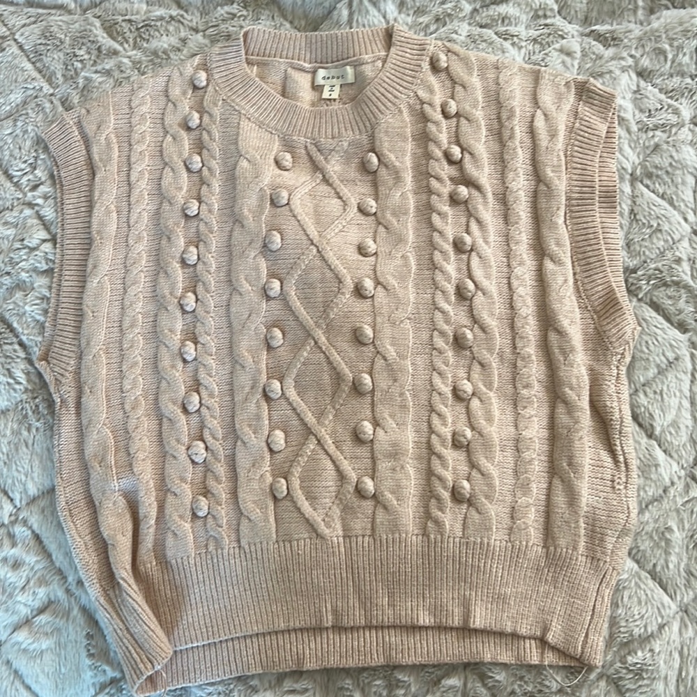 Debut top. Never worn, tags removed.